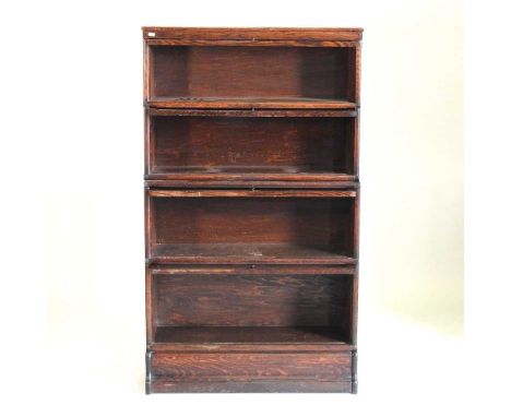 An early 20th century Globe Wernicke oak glazed four tier sectional bookcase, on a plinth base87w x 32d x 149h cm