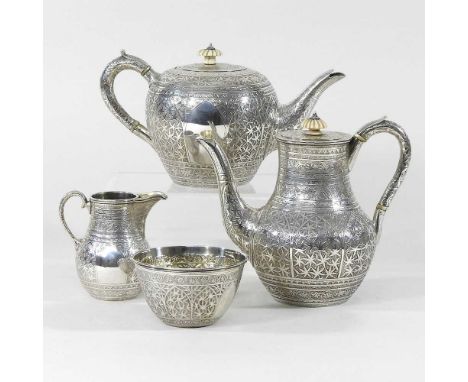 A Victorian silver four piece tea service, finely engraved with Eastern style decoration, comprising a teapot, 11cm high, cof