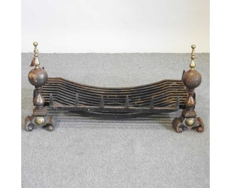 A cast iron fire grate, 94cm wide, together with a pair of fire dogs