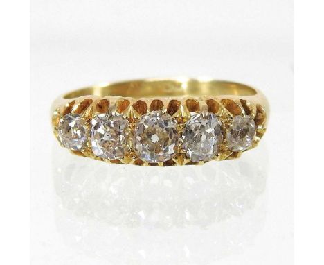 A yellow metal diamond ring, set with five graduated stones, 5.1g gross, size M/N, boxed