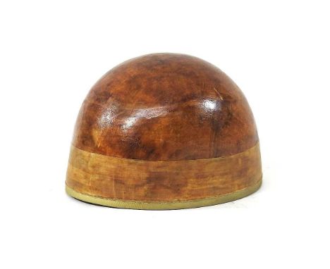 A vintage jockey skull cap, bearing a label for Bates of London