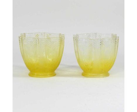 A pair of yellow and clear glass light shades, with etched decoration, 9cm aperture (2)