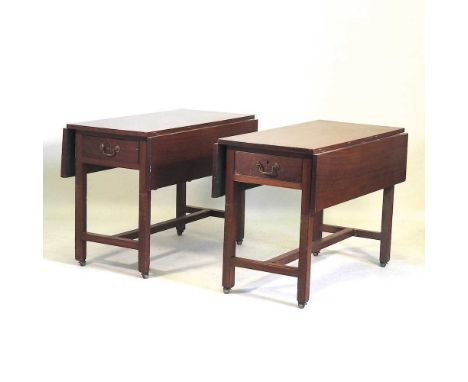 A pair of George III military campaign teak drop leaf dining tables, each with a hinged rectangular top, on hinged folding le