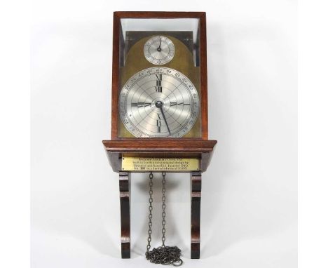 A reproduction of Benjamin Franklin's clock, by Thwaites &amp; Read Ltd, ltd ed 159/1000, 26cm high on a wooden bracket, with