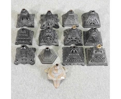 A collection of twelve cast iron oil lamp bases, together with another (13)