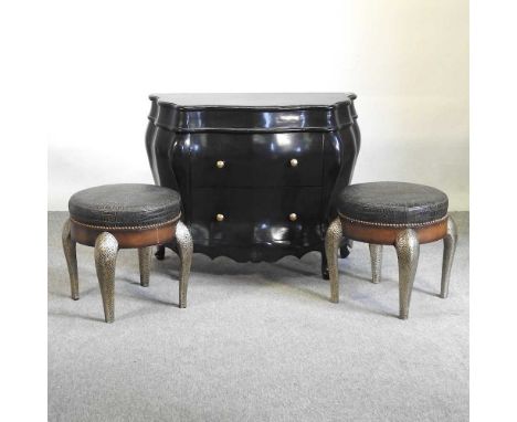 A pair of silver painted stools, 45cm dia, together with a black painted commode chest (3)