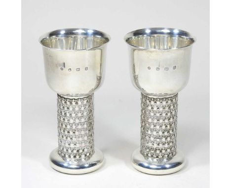 A pair of modern silver goblets, with textured stems, by Jack Spencer, Sheffield 1973, 15cm high, 504g, boxed with receiptOve