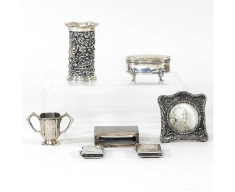 Two silver vesta cases, together with a matchbox holder, small trophy cup, vase, trinket box and picture frame, 7 x 7cm (7)