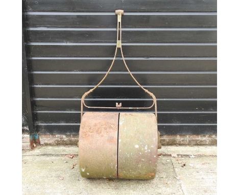 An early 20th century cast iron garden roller69cm wide