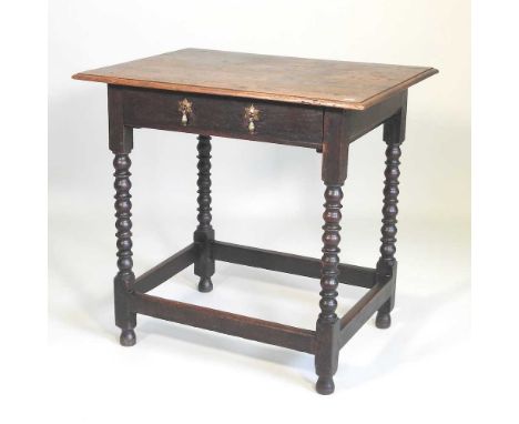 An 18th century oak side table, with a single drawer, on bobbin turned legs74w x 54d x 71h cm