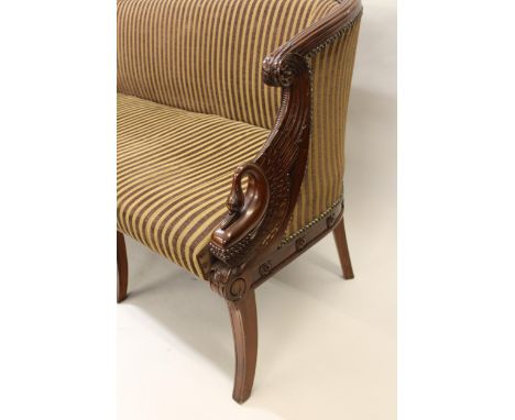 20th Century mahogany Regency style bow back sofa with carved swan neck arms and sabre leg front supports and striped upholst