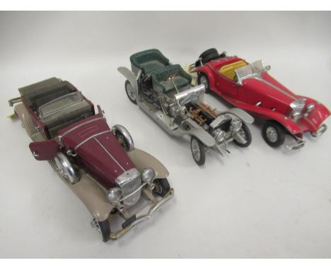 Group of three 1/24 scale diecast metal models of vintage cars 