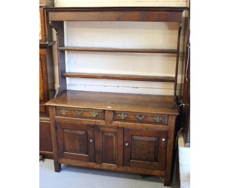 Small 18th Century oak dresser, the open shelf back above two drawers and two fielded panel doors on stile supports, 54.4ins 