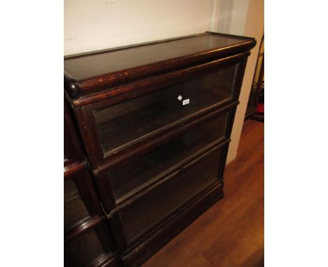 Globe Wernicke, early 20th Century oak three section glazed bookcase, with drawer, 34ins wide x 12ins deep x 46ins high 