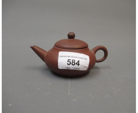 Yixing Chinese small terracotta teapot, signed with seal mark to base 