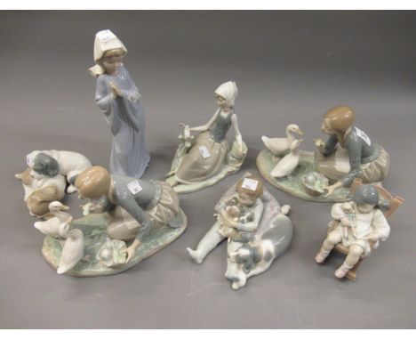Five various Lladro porcelain groups and figures together with two Nao figures 