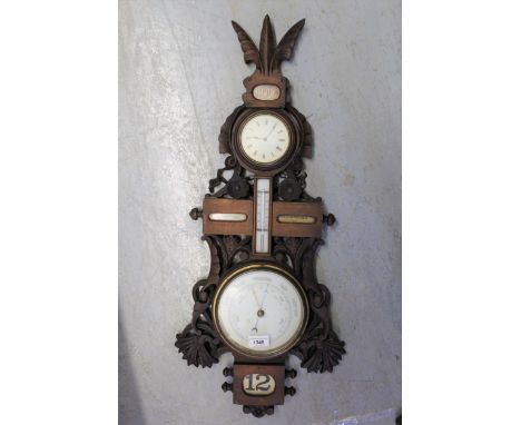 Late 19th / early 20th Century carved walnut aneroid barometer / thermometer with clock and calendar 
