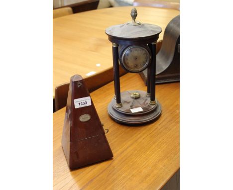 Early 20th Century portico clock with a single train keywind movement, together with three dome shaped mantel clocks and a mo