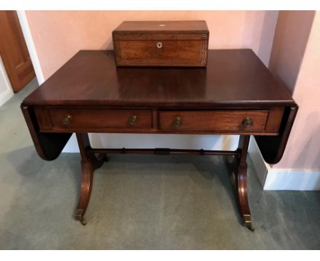 Mid 20th Century mahogany rectangular drop-leaf sofa table in Regency style, the two frieze drawers with brass knob handles, 