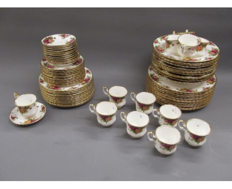 An extensive Royal Albert Old Country Roses pattern dinner service comprising:  twelve dinner plates, twelve soup bowls, twel