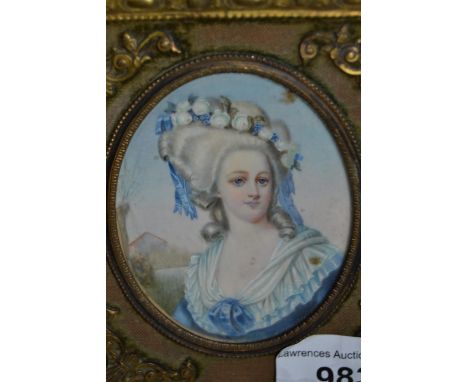 Late 19th / early 20th Century watercolour portrait miniature of a lady wearing a blue dress, in a gilt metal frame with pier