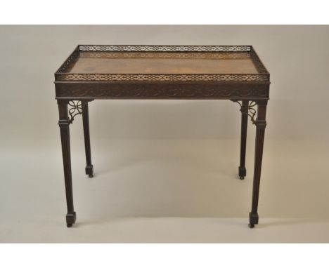 Good 19th Century mahogany silver table of Chippendale design, the rectangular galleried top above a blind fretwork frieze an