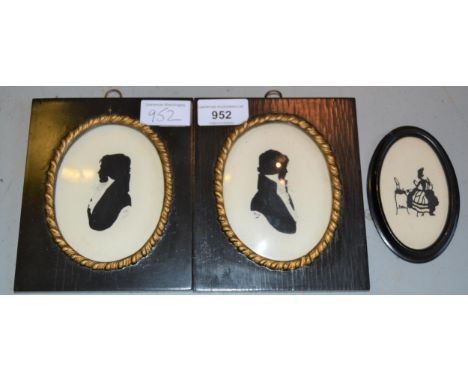 Pair of 20th Century oval mounted miniature silhouette portraits of gentlemen, signed Ray, framed, together with a small oval