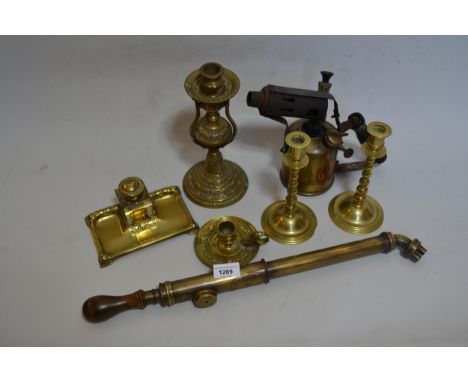 Brass inkstand, various brass candlesticks, a brass garden spray and blow lamp 