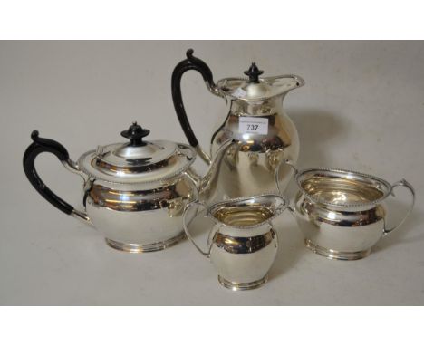 Four piece oval silver tea service, Sheffield 1919, 49 troy oz. including two ebonised wooden handles 