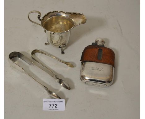 Edinburgh silver cream jug on low supports (at fault), pair of London silver sugar tongs, pair of plated sugar tongs and a si