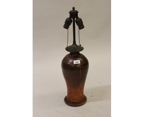 Mid 20th Century Continental pottery baluster form table lamp with patinated metal two branch fitting, 24ins high including f