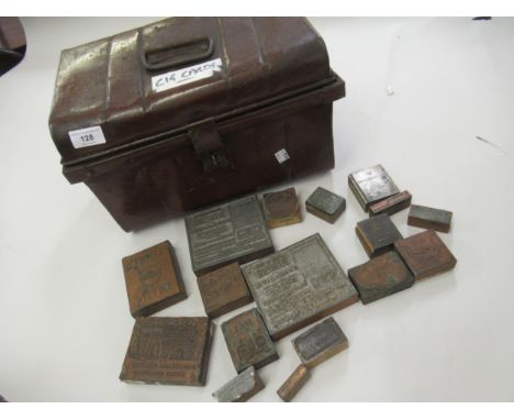 Small brown tin trunk together with a quantity of printing blocks 