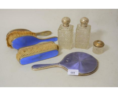 Pair of silver mounted cut glass perfume bottles, similar small bottle and five silver mounted enamel dressing table items 