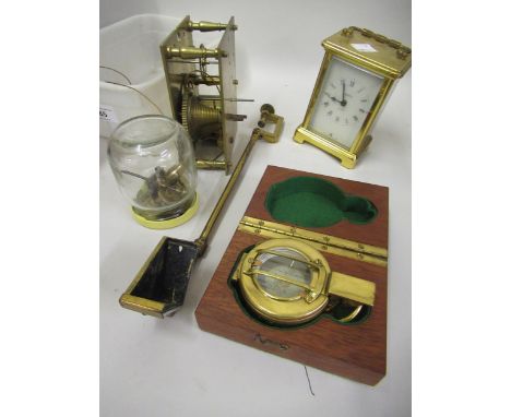 Reproduction compass in mahogany case, a brass carriage clock, a clock movement and a table clamp 