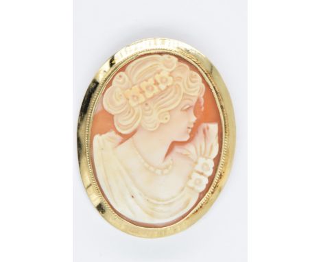 20th Century 9ct gold mounted cameo brooch carved with a portrait of a girl in profile, 45mm x 35mm overall 