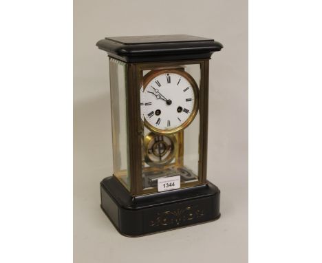 Late 19th Century French black slate and gilt brass four glass library clock, the enamel dial with Roman numerals, the two tr