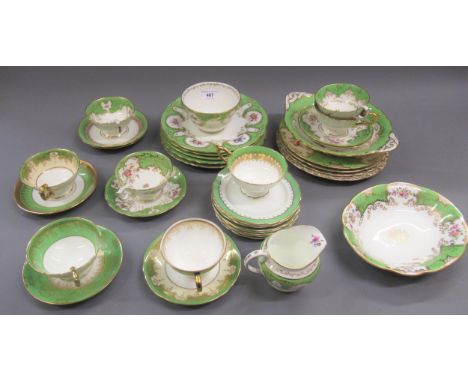 Quantity of Coalport and George Jones green gilt and floral decorated teaware comprising:  nine various plates, eight small s