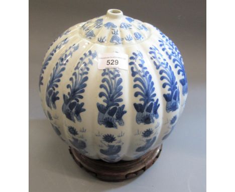 20th Century Chinese blue and white globular form lamp base, with stylised foliate decoration, on hardwood stand, 11.25ins hi