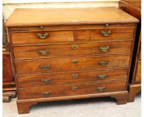 George III mahogany chest, the moulded top above a brushing slide, two short and four long drawers with brass handles, raised