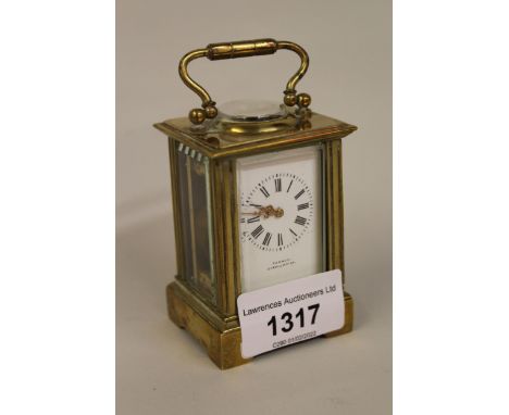 Miniature early 20th Century brass cased carriage clock, the enamel dial with Roman numerals, signed Tanner, Cirencester, wit
