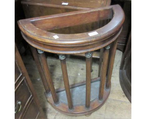 20th Century mahogany semi circular stick stand on turned fluted supportsNone of the columns have been broken and the capital