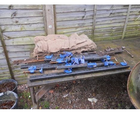 Large collection of sash clamps and sand bags