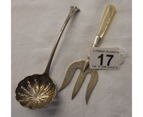 Silver sugar sifter and silver cake fork