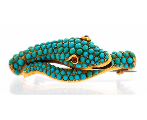 A Victorian turquoise yellow metal snake brooch, the snakes head over tail set with round cabachon turquoise, ruby glass eyes