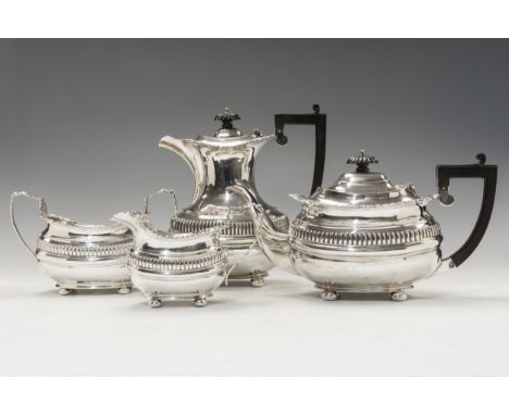 An Edward VII four piece silver tea service with gadroon and scallop border, fluted frieze, Birmingham, 1908, Elkington &amp;