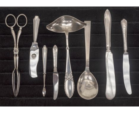 A collection of 20th Century North European silver and white metal including sifting spoon, sauce ladle, table spoons, herrin