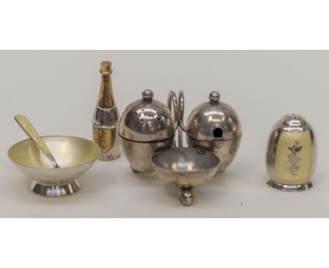 A collection of table silver including: a George V silver condiment set, ovoid shaped pepper pot on trefoil stand with attach