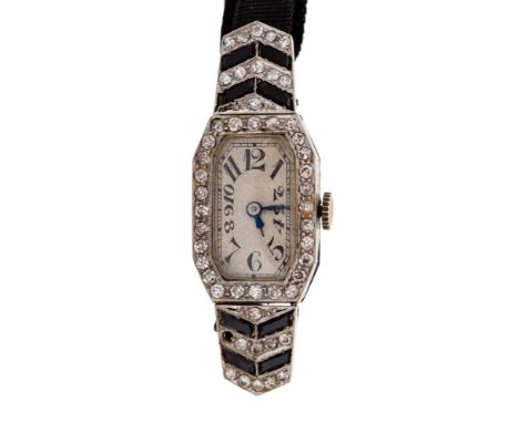 An Art Deco diamond set platinum cocktail watch, octagonal shaped head with diamond set bezel, continuing to arrow shaped dia