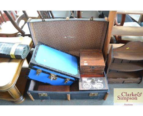 A travelling trunk with various wooden storage boxes etc.