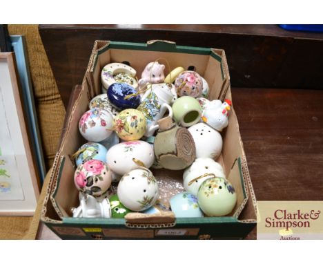 A box of various ceramic pomanders